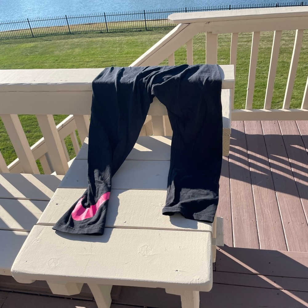 Nike leggings with a pink swish